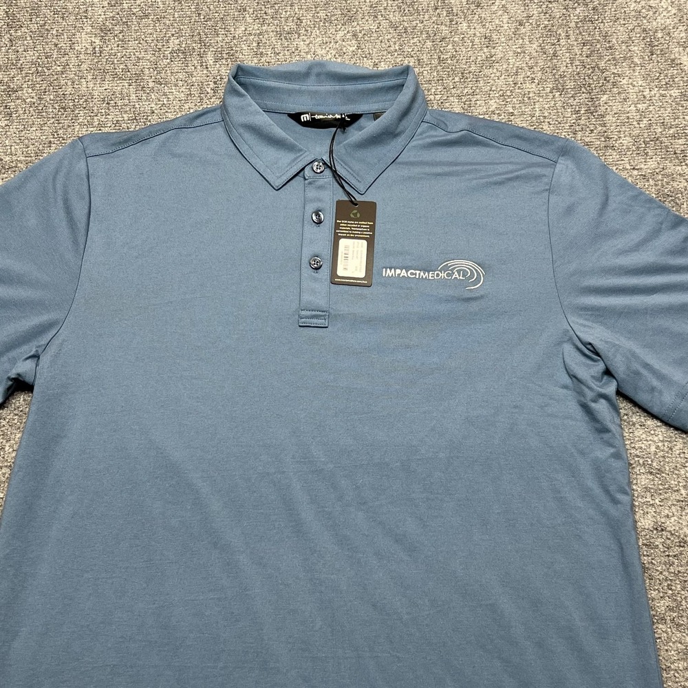 TravisMathew Glenview Solid Polo Shirt Mens Large Blue Impact Medical Logo Golf